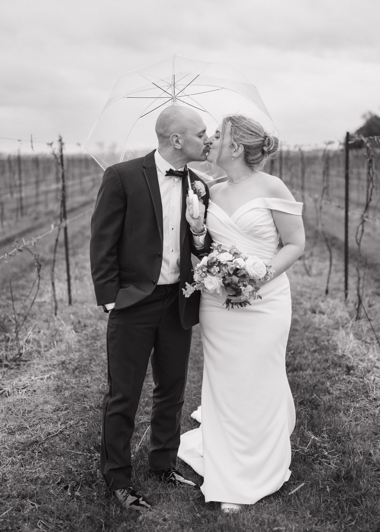 Couple kissing in vineyard at Holland Marsh Winery in Newmarket Ontario