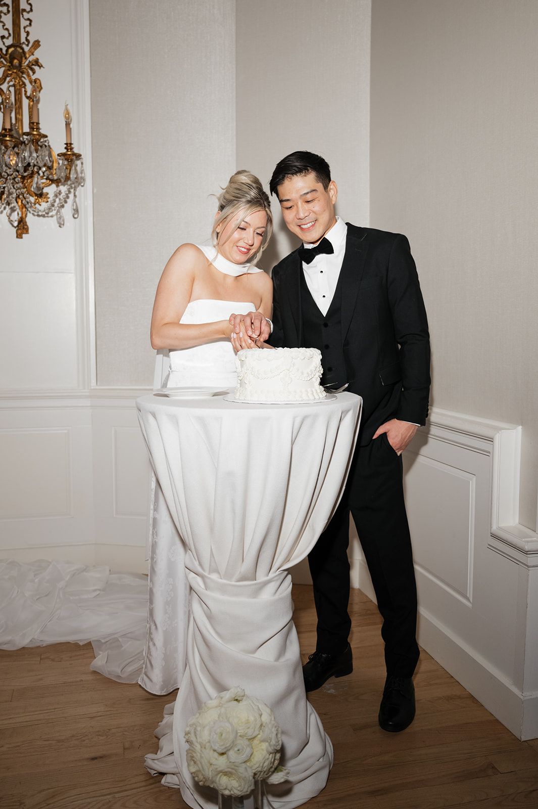 Couple cutting cake at Fairmont Royal Hotel in Toronto