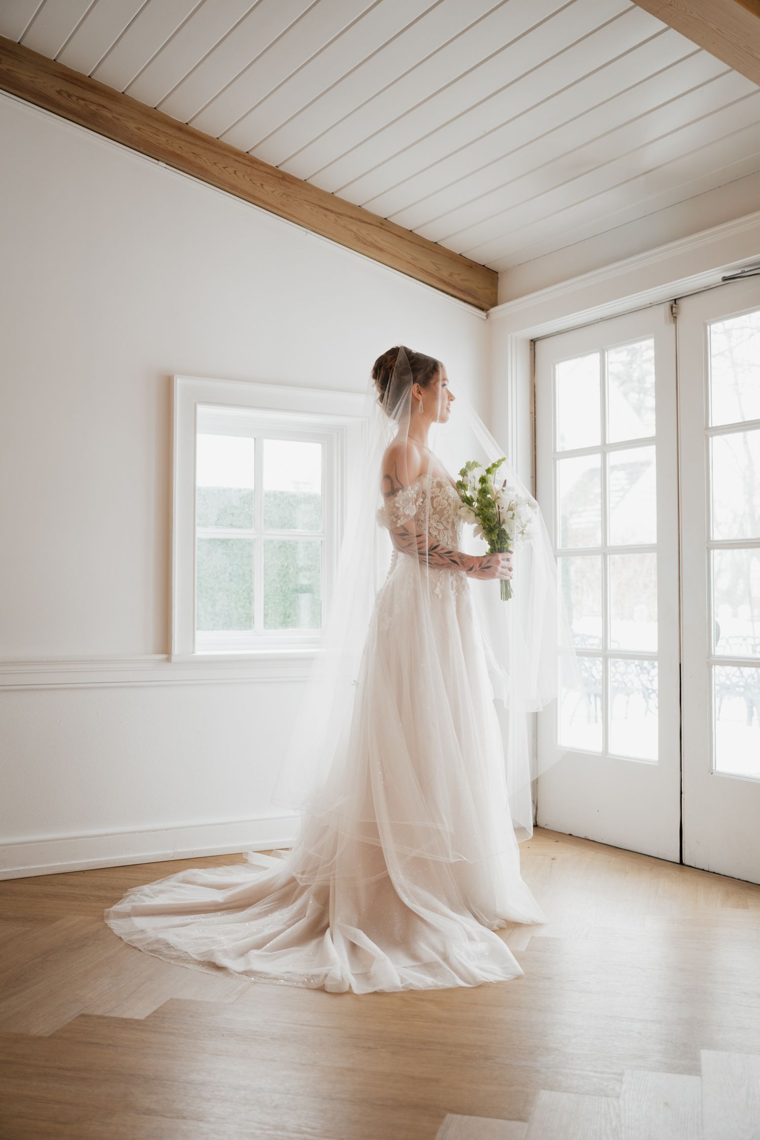 Bride looking out the window at The Doctors House, Kleinburg