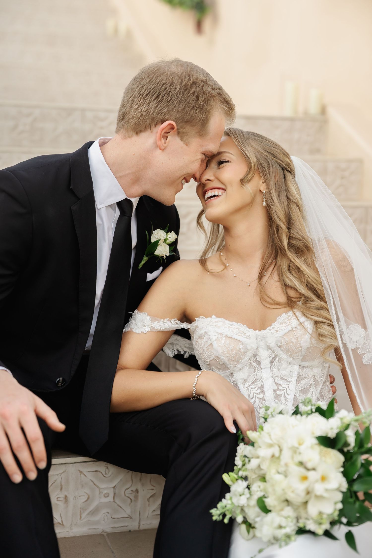 Joyful wedding couple sharing intimate moments during their formal portraits.