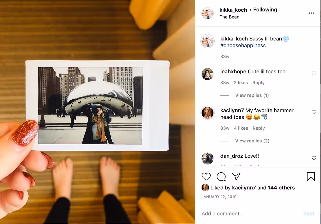 Kayla Koch Photo holds a polaroid taken outside of The Bean in Chicago, IL.