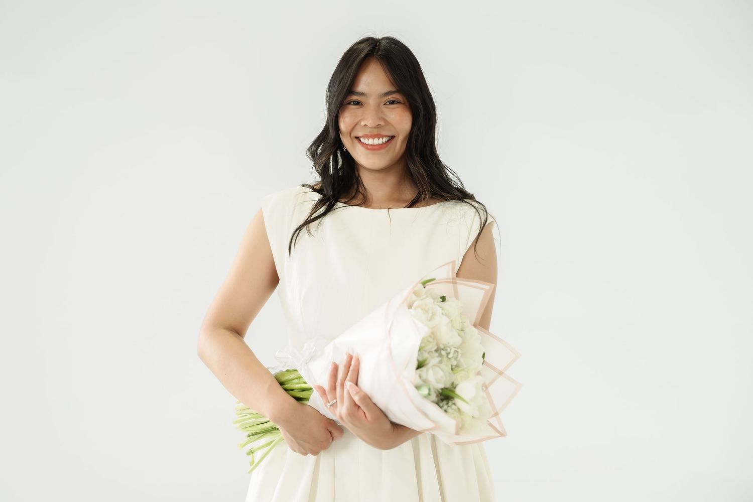 Professional studio portraits against white backdrop showcasing natural joyful expressions.
