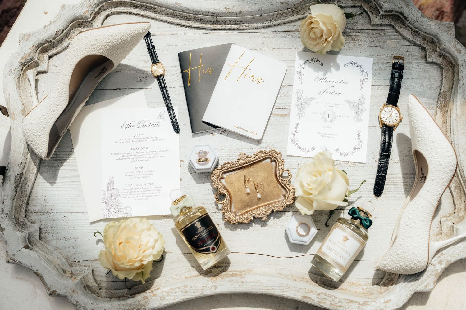 Flatlay of white paper, fountain pens, ink bottles, and wax seals arranged on a light surface for calligraphy.