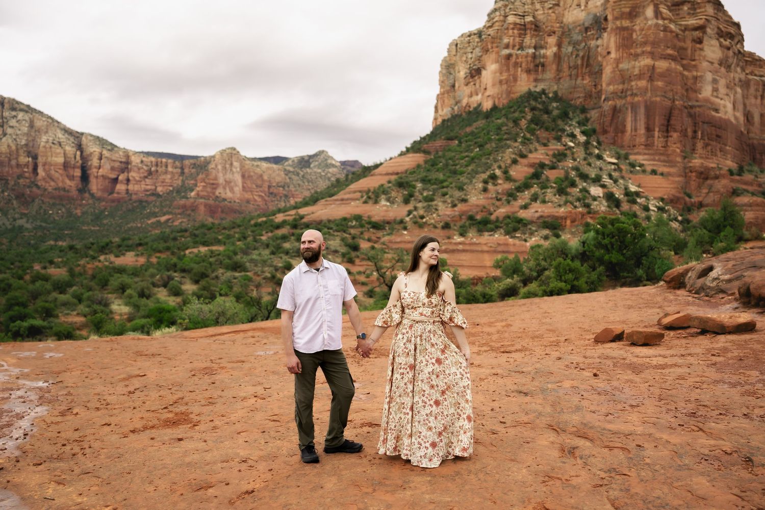 Desert wedding photos against dramatic red rock formations in Sedona.