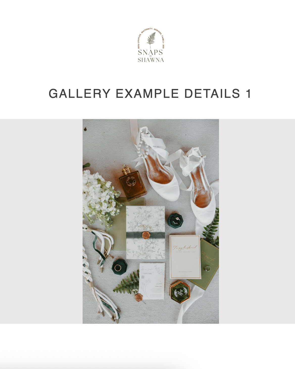 Wedding stationery flat lay with elegant white cards, floral elements, and vintage styling details on a light background.
