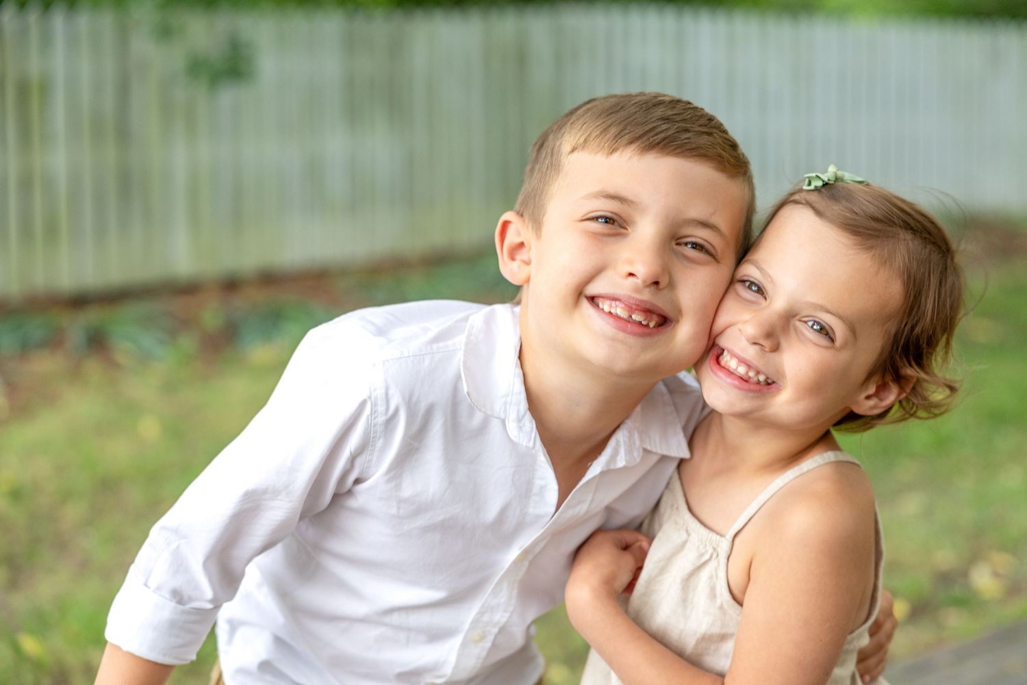 A series of candid outdoor family photos showing joyful moments and embraces in a natural setting.
