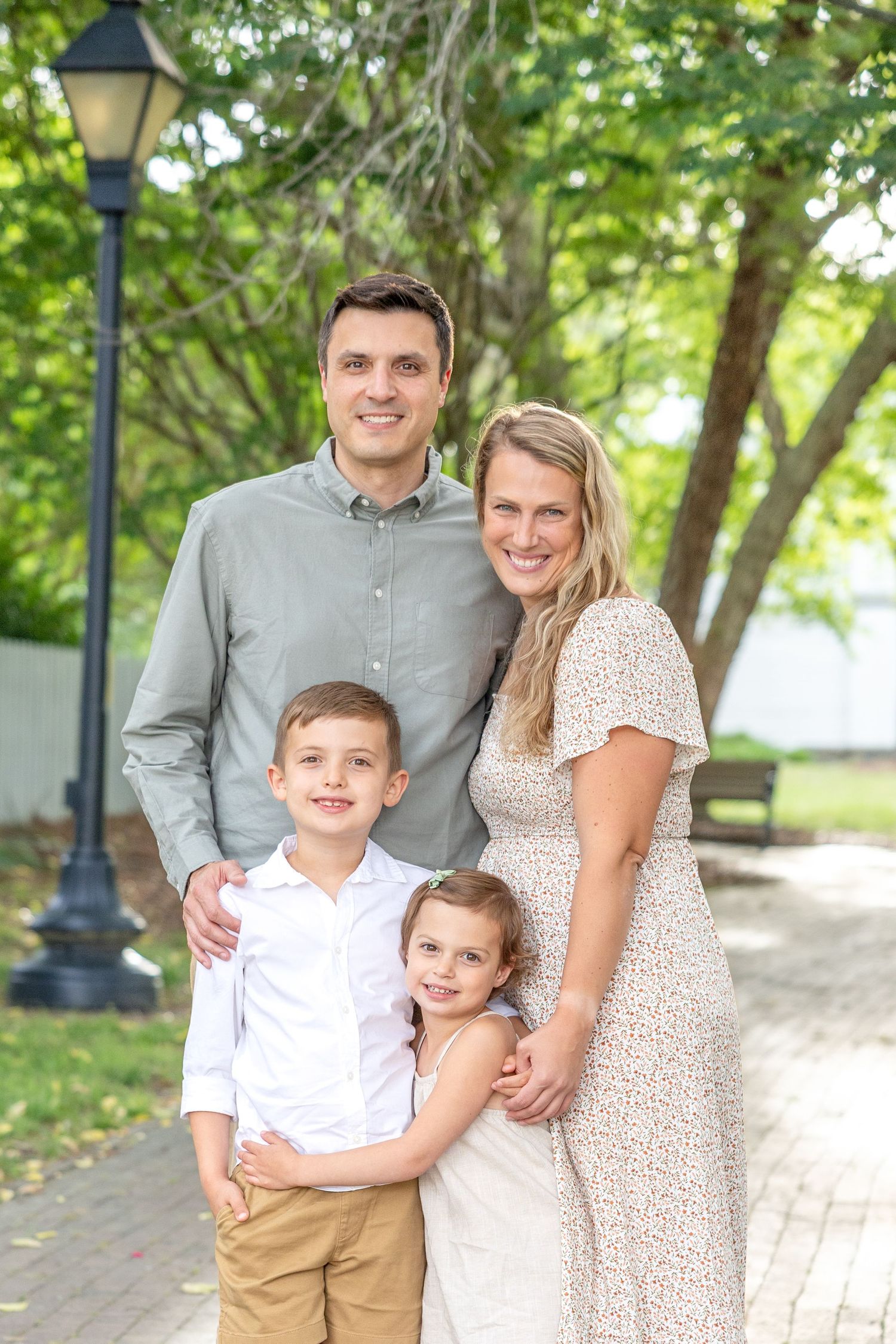 Family portrait series taken outdoors in Raleigh at Historic Oak View Park in the Spring Time.