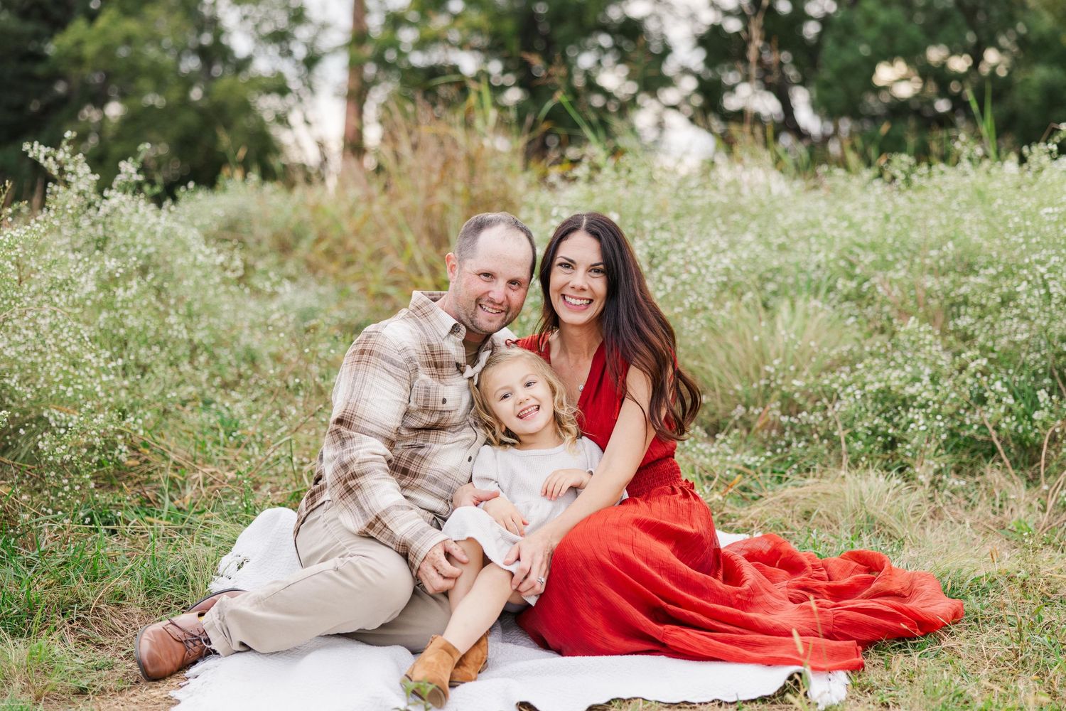 Jessie Peloso Photography, a family photographer in Raleigh and Clayton, North Carolina, poses for a photo wit her family.