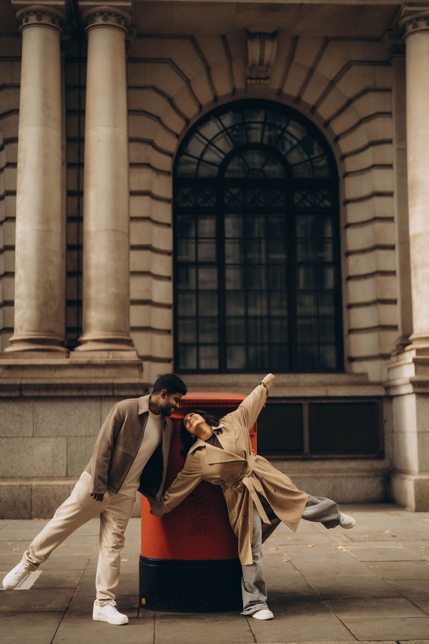 Contemporary dance sequence showing fluid movements against a classical architectural backdrop.
