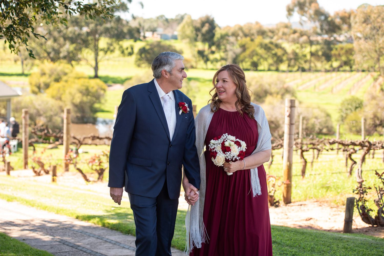 Bride and Groom walking hand in hand - Kelly Chapman Photographer Perth