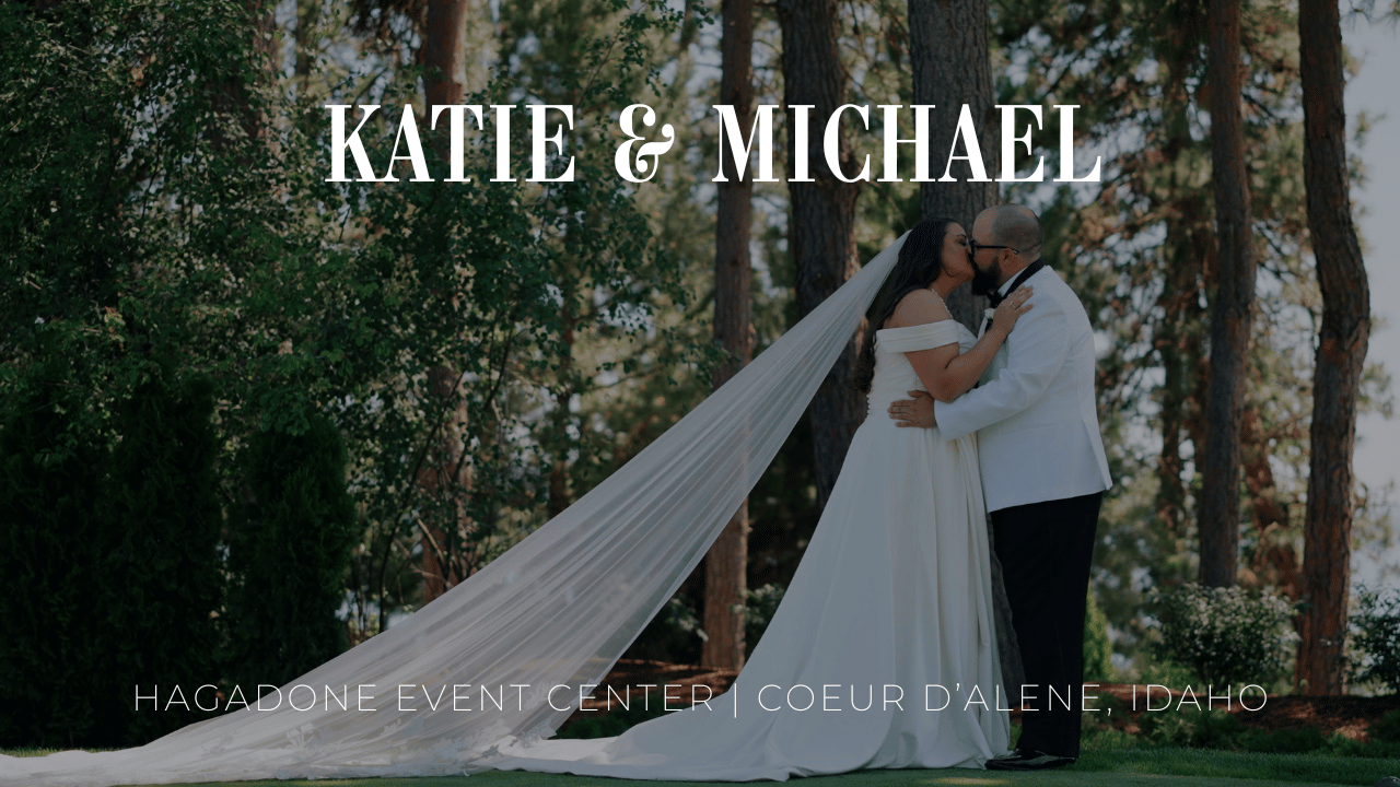 Elegant outdoor wedding ceremony setup with white chairs and floral arrangements in a wooded forest setting.