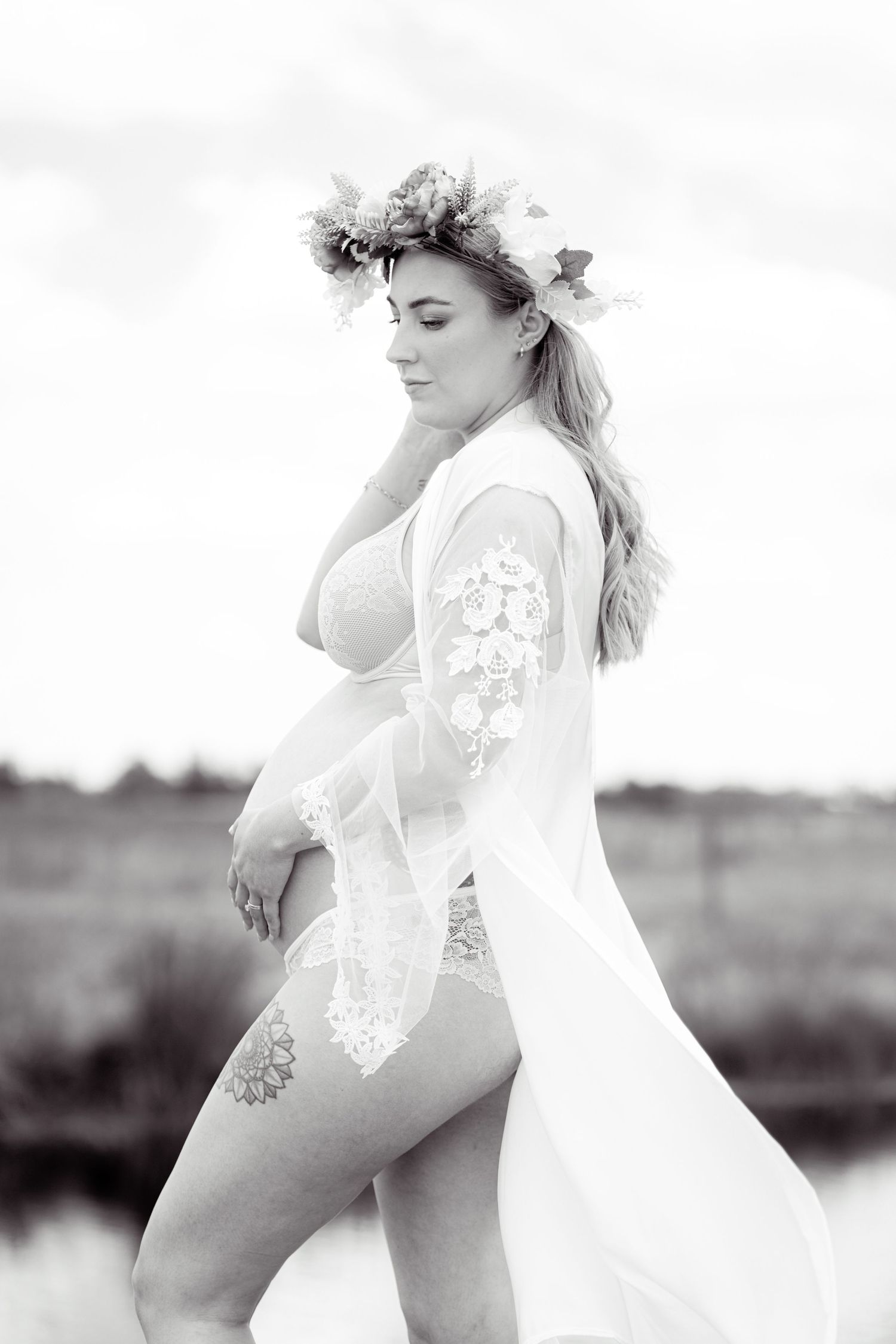 Dreamy black and white maternity portraits in a field with lace details.