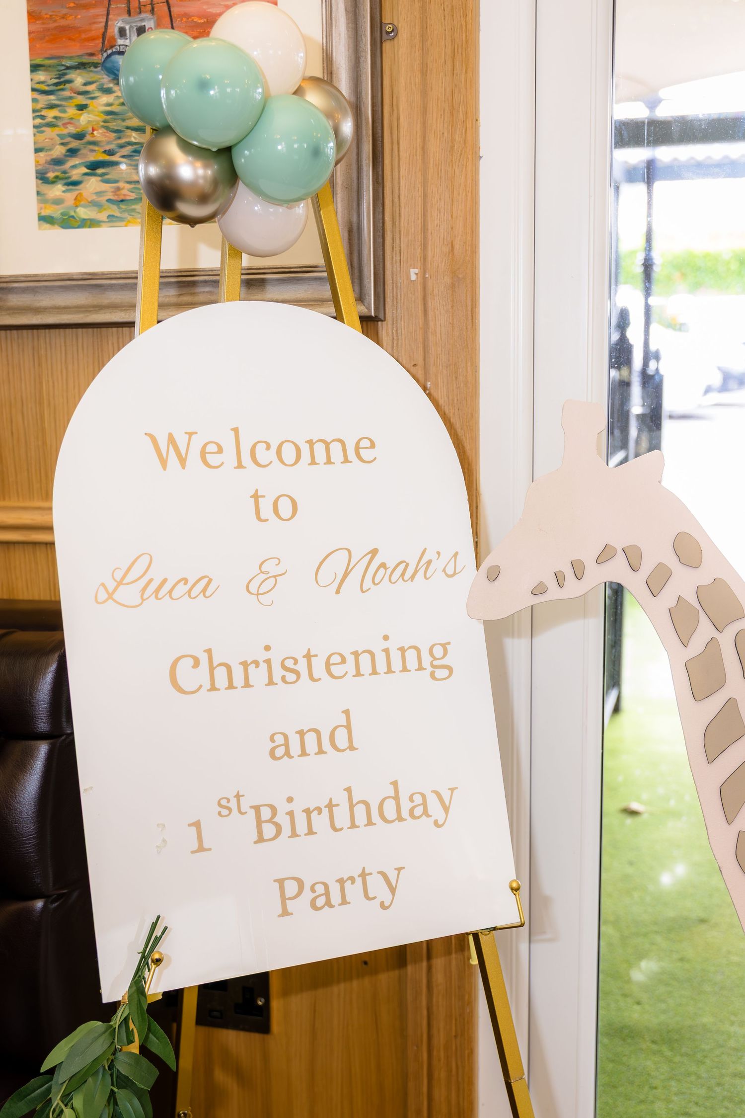 Welcome signs for christening and first birthday party with mint green and gold decorations.