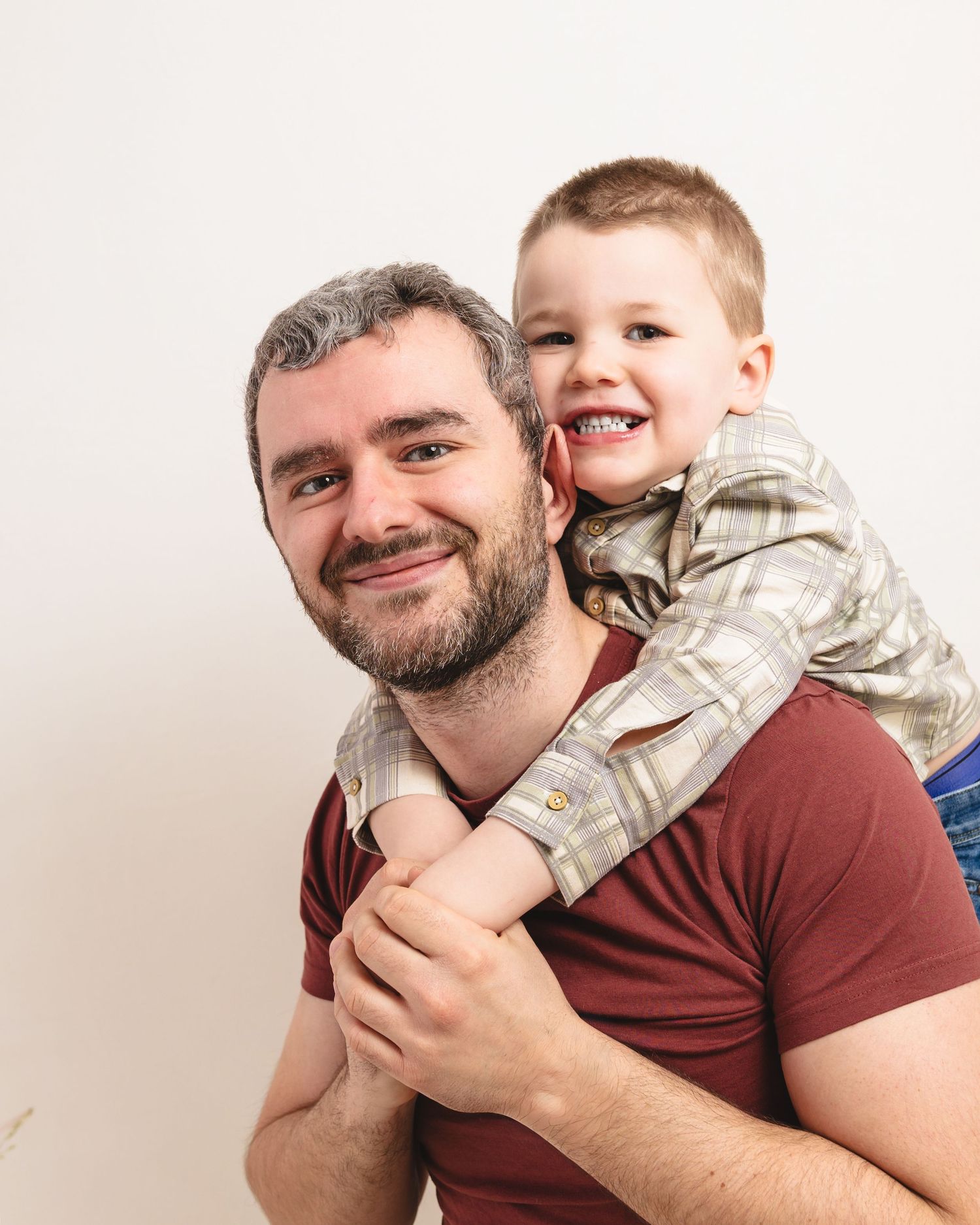 A series of candid portrait shots showing joyful moments between a parent and child against a white background.