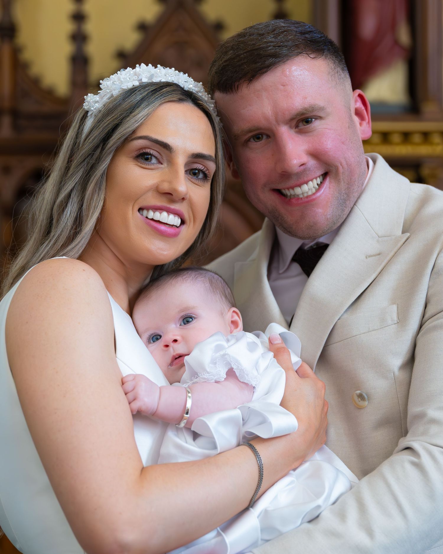 A series of tender family moments captured in formal attire with white and cream tones.