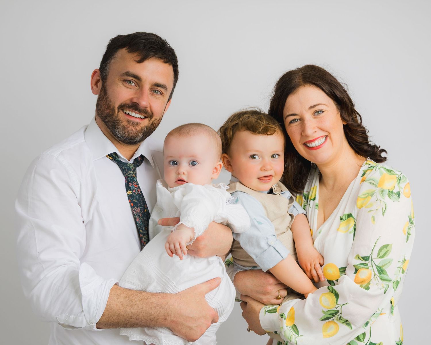 Family photo session collage showing tender moments against white background.