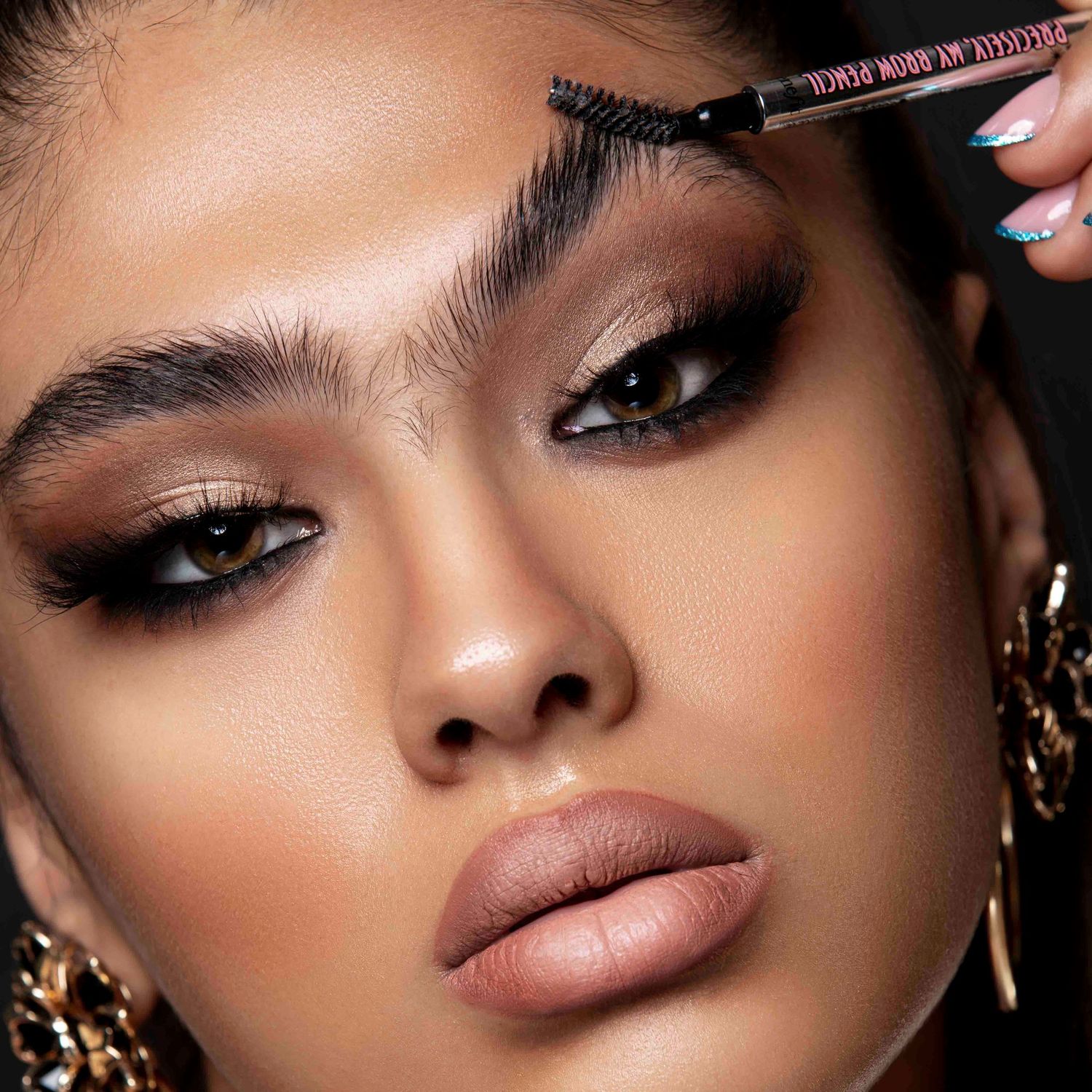 Beauty photography showing flawless makeup with emphasis on defined brows and contoured cheeks.