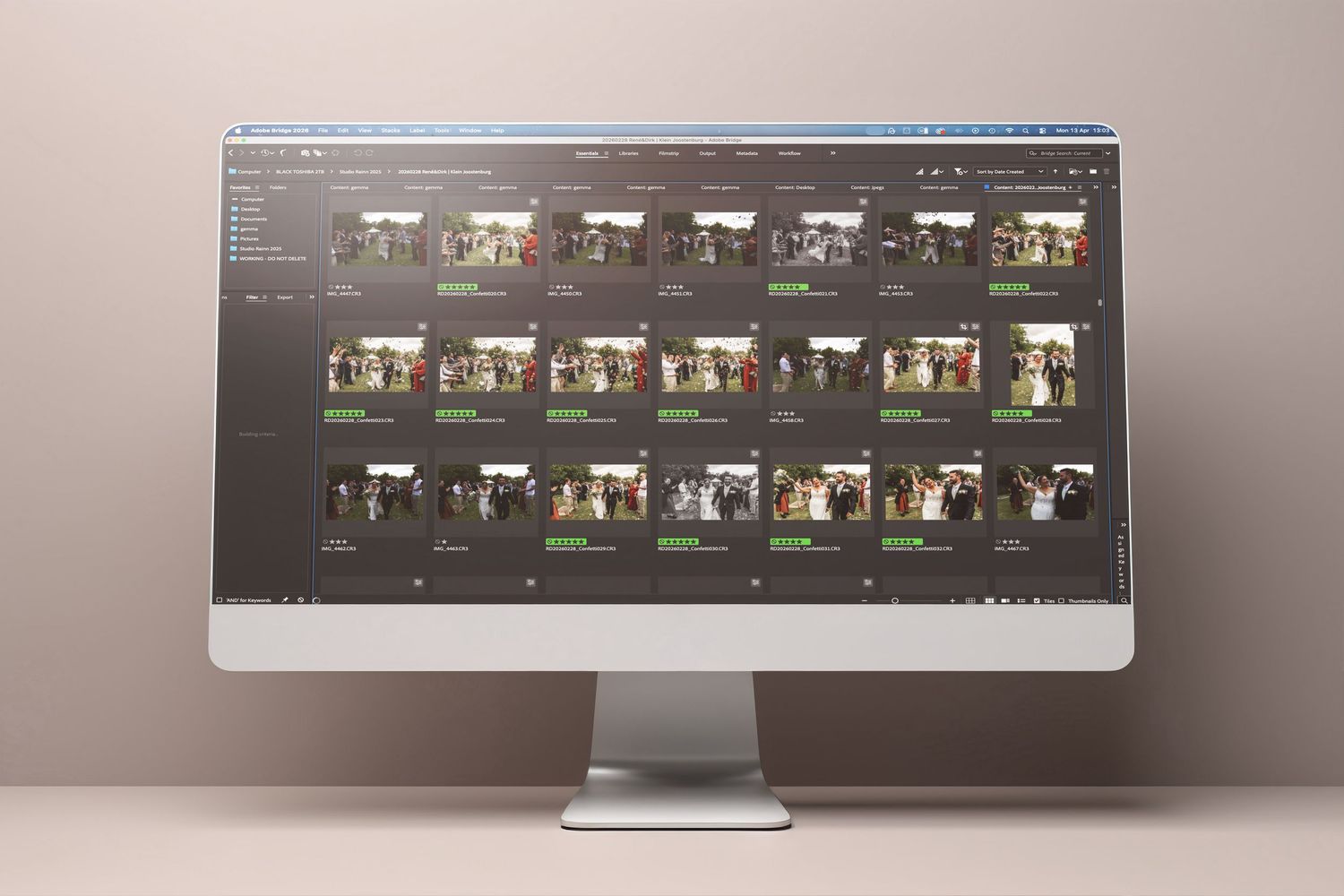 A desktop computer displaying photo editing software with a grid of wedding event photos in a dark-themed interface.