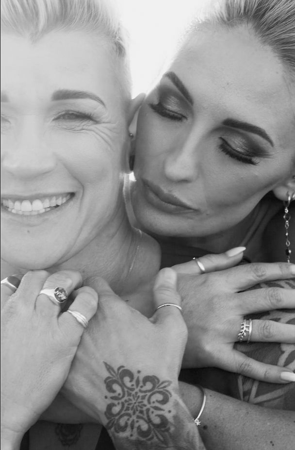 A sequence of intimate black and white photos showing a couple embracing and kissing.