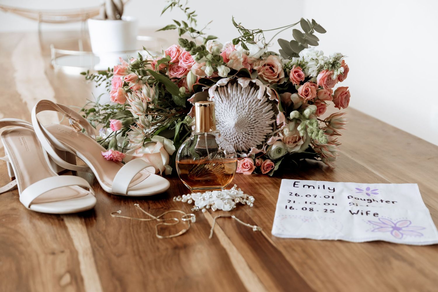 Wedding details collage showing white shoes, floral arrangements, and table settings in warm neutral colors and pink accents.