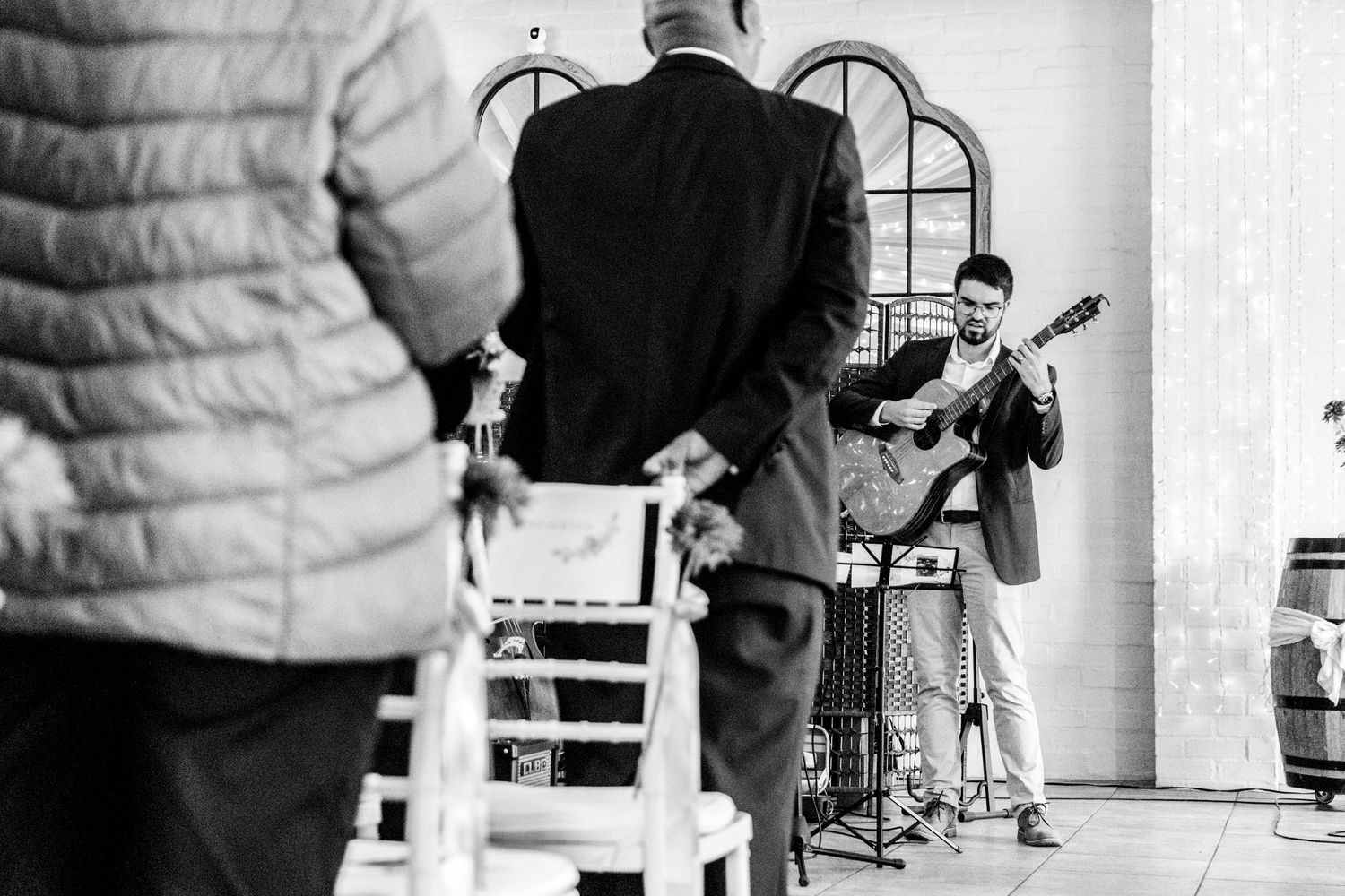 Musicians recording and performing together in a black and white montage of studio recording sessions.