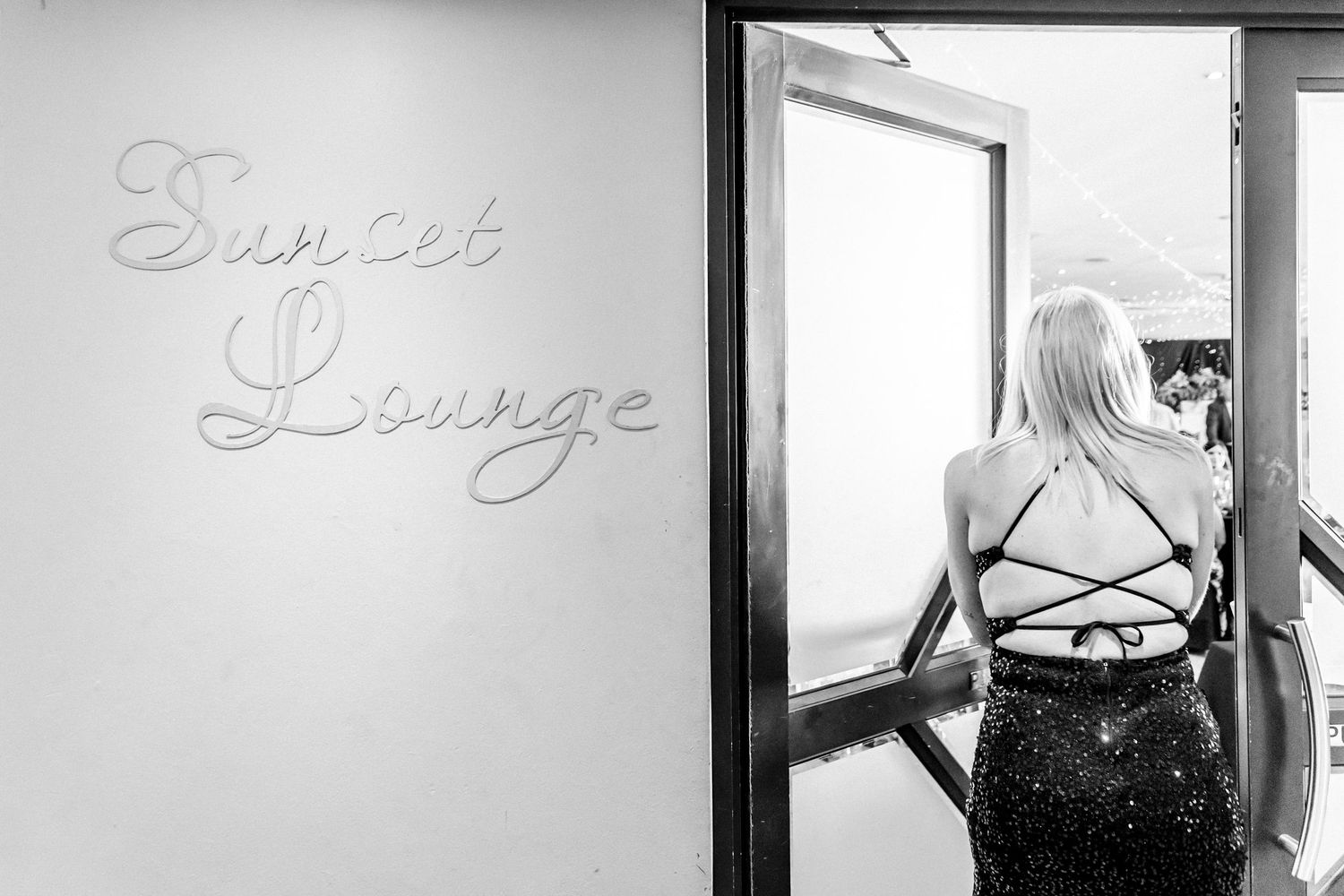 A series of black and white photos showing close-up shots of lingerie and corsets against light backgrounds.