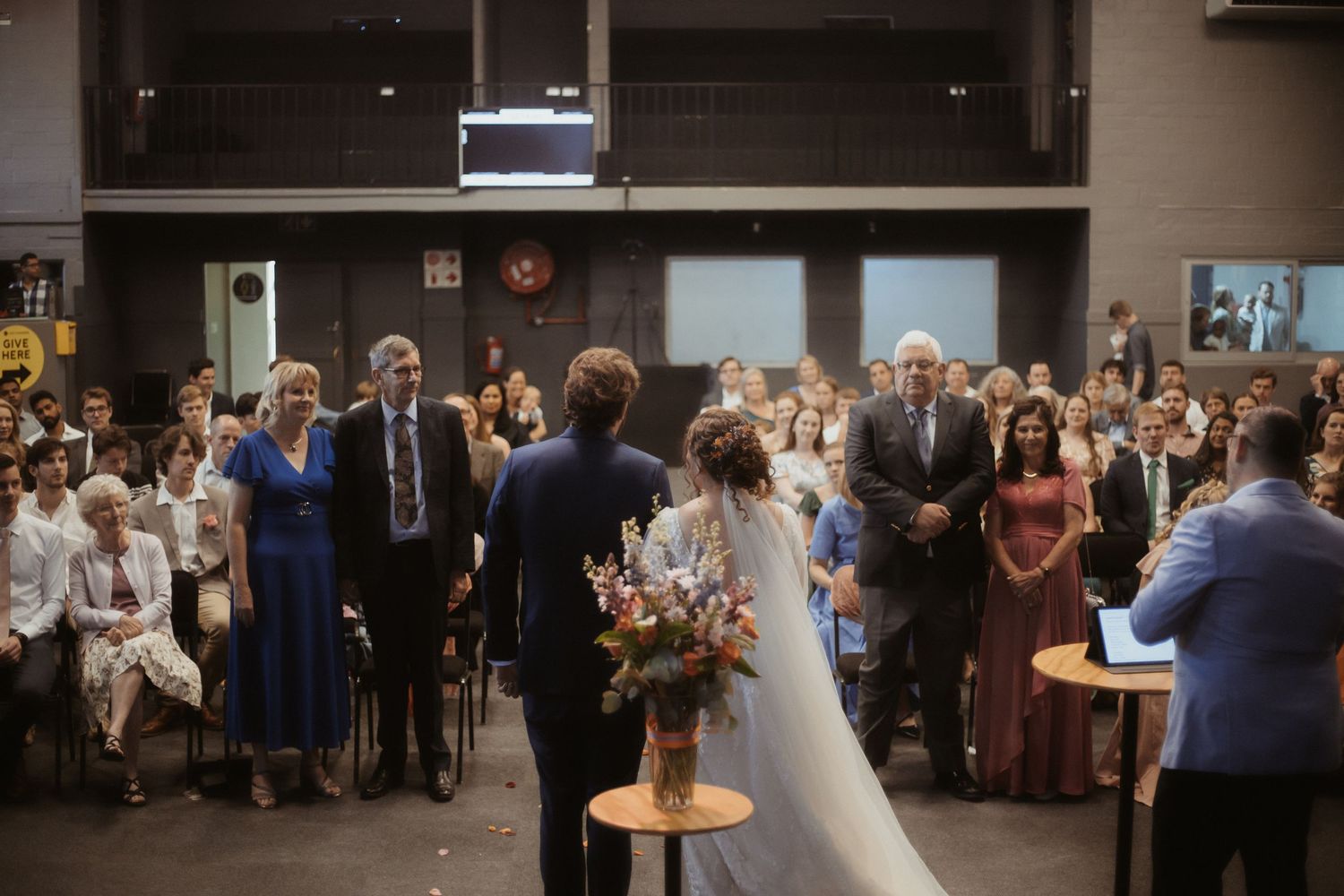 A wedding reception dance sequence showing multiple moments of celebration in an indoor venue.