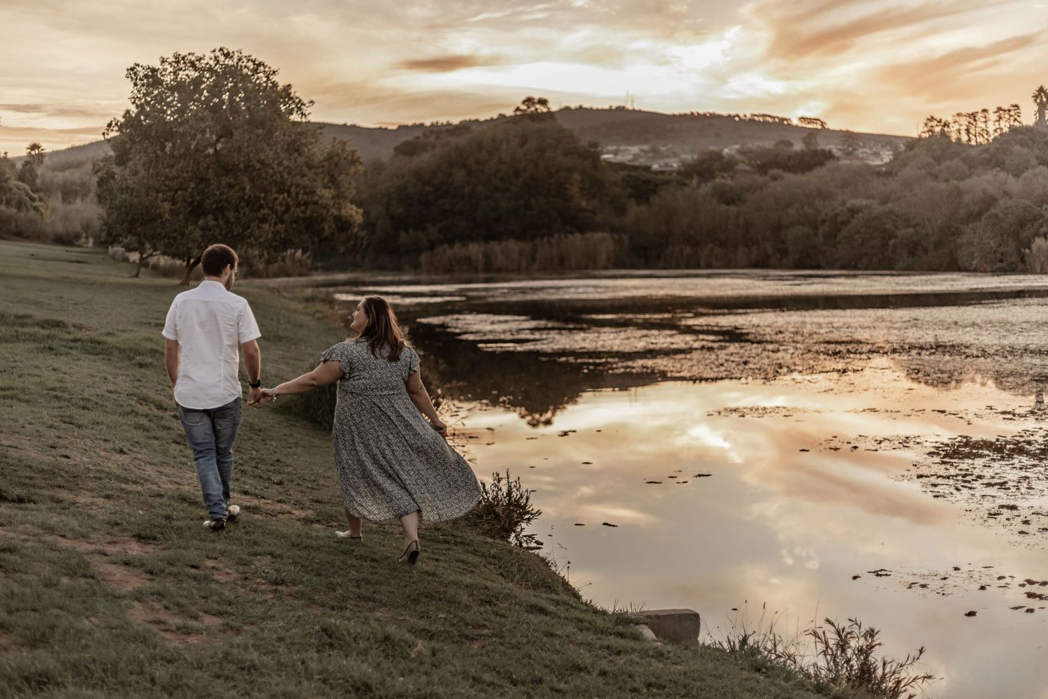 A series of sunset photos showing silhouettes of people walking near a tranquil lake with golden light reflecting on water.