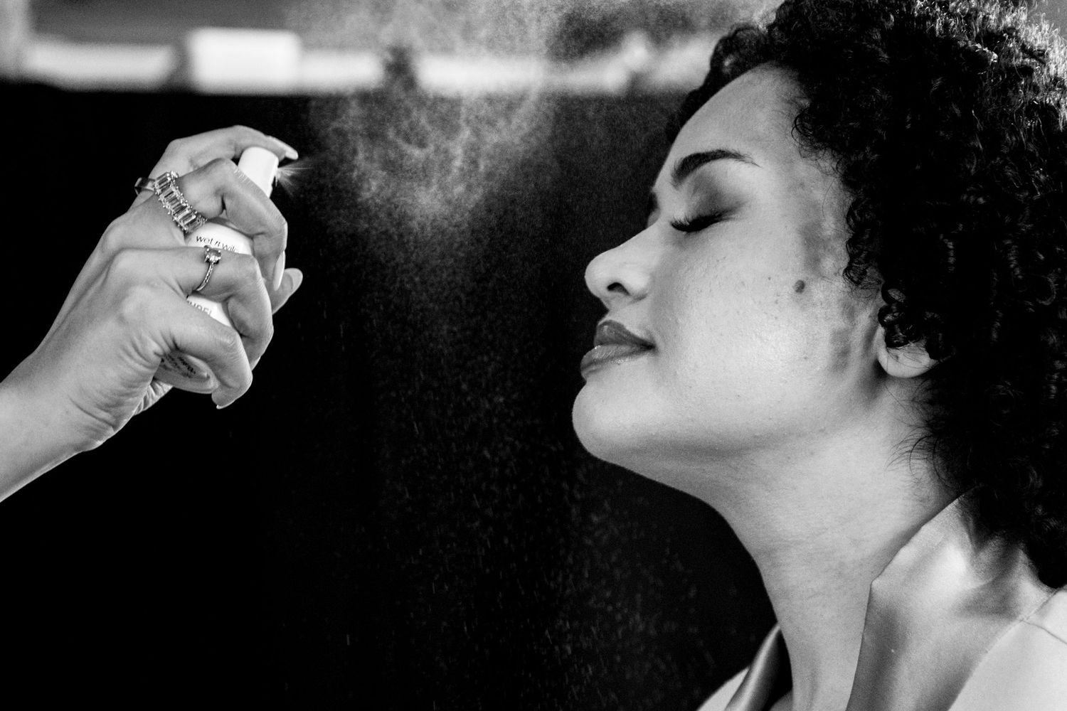 A series of artistic black and white photographic portraits showing elegant profile poses against dark backgrounds.