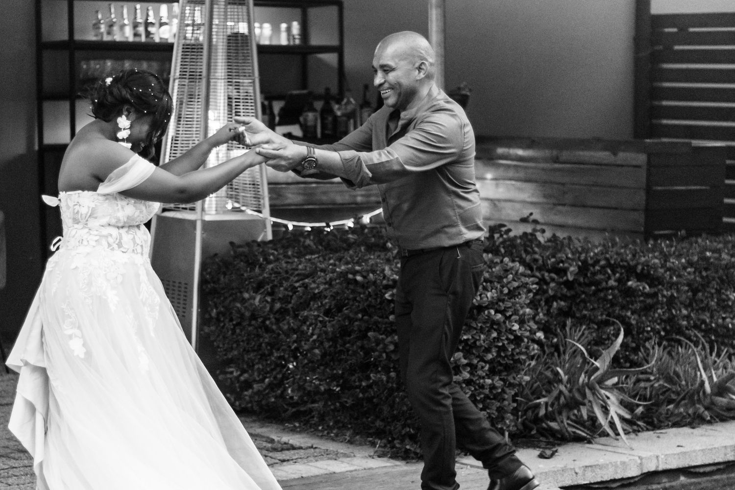 A collage of black and white wedding photos showing dances and romantic moments from a wedding reception celebration.