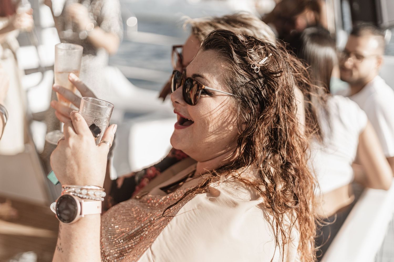 Sequence of photos showing person with jewelry laughing and enjoying a joyful candid moment.