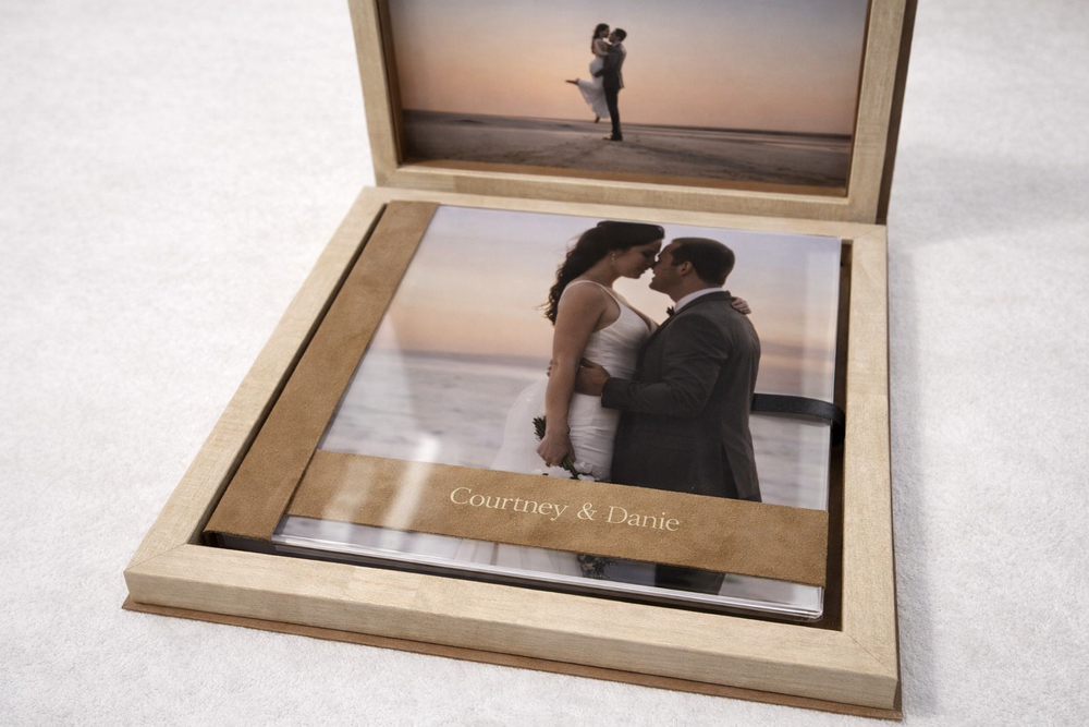 Elegant wedding photo album box with couple embracing at sunset, personalized with names Courtney and Danie.