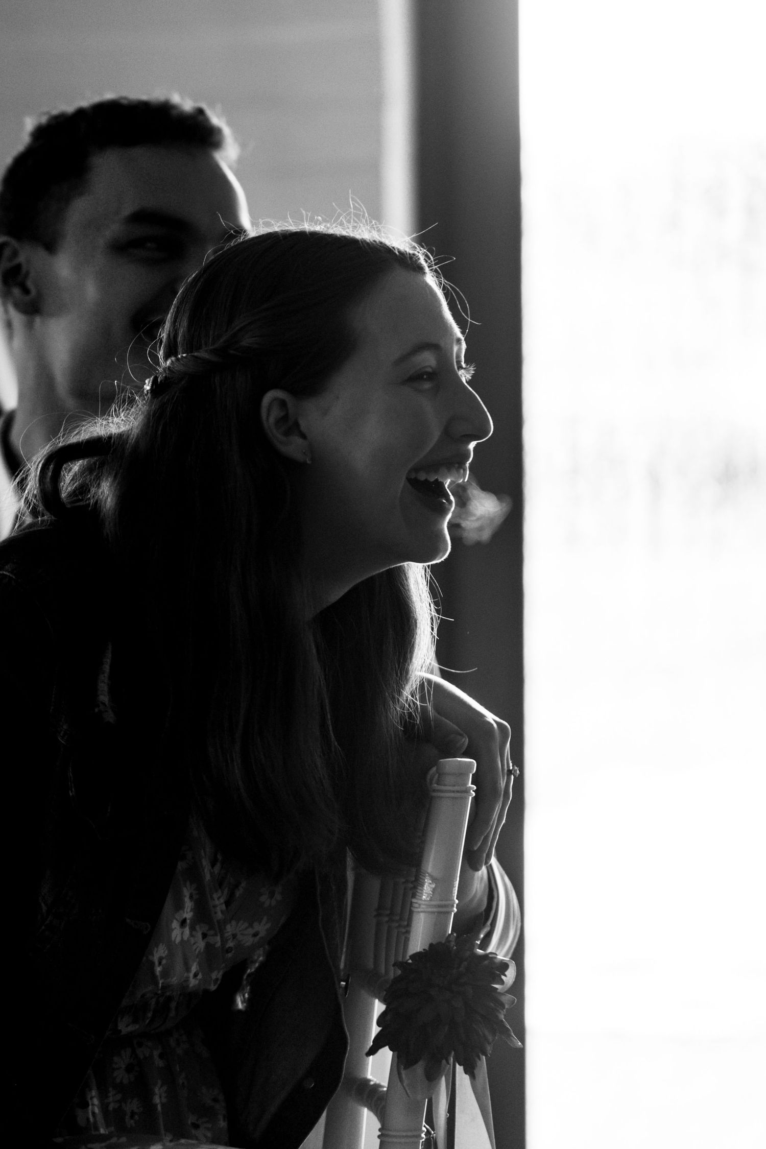 A series of black and white profile portraits showing someone with long hair in dramatic lighting.