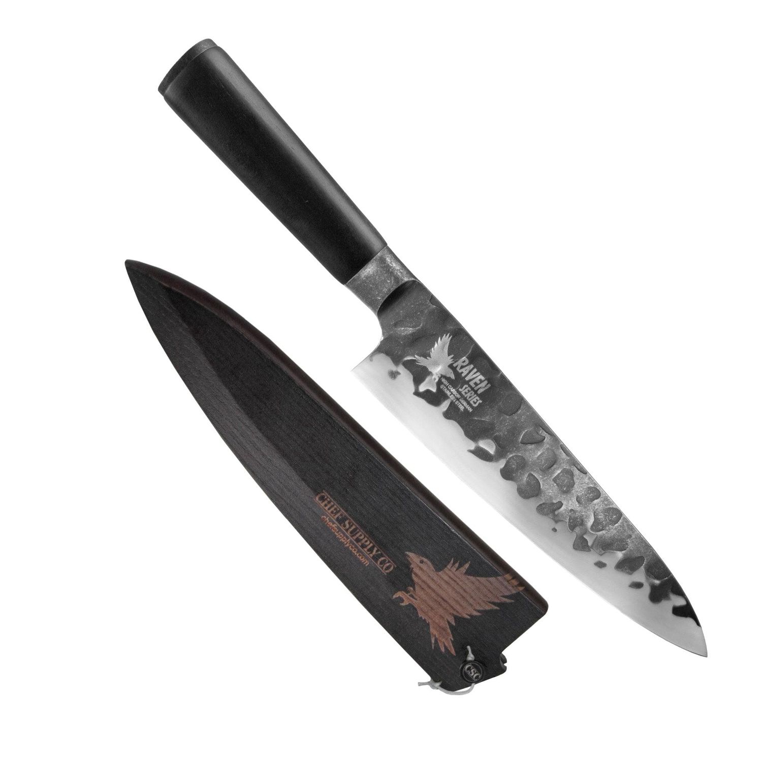 A Santoku kitchen knife with hammered steel blade and black handle shown next to its protective sheath.