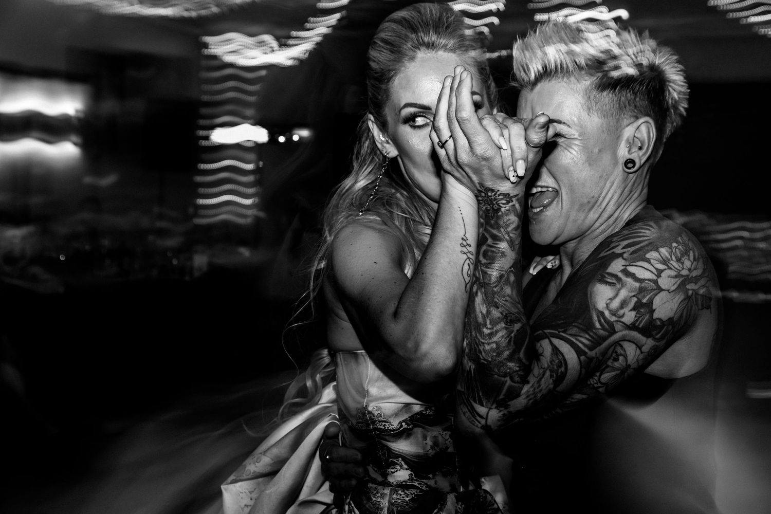 Black and white photographs showing a romantic couple kissing in different artistic poses and compositions.