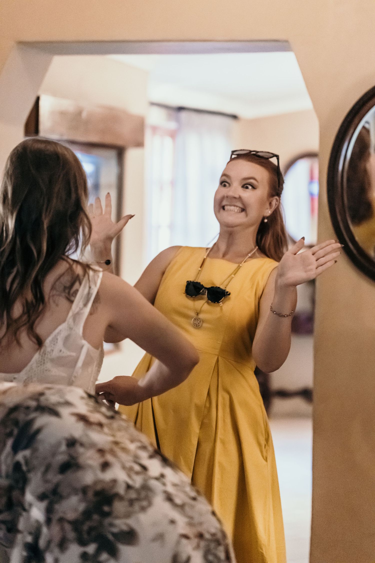 Woman in bright yellow dress reacts with joy and surprise in a multi-panel photo series.