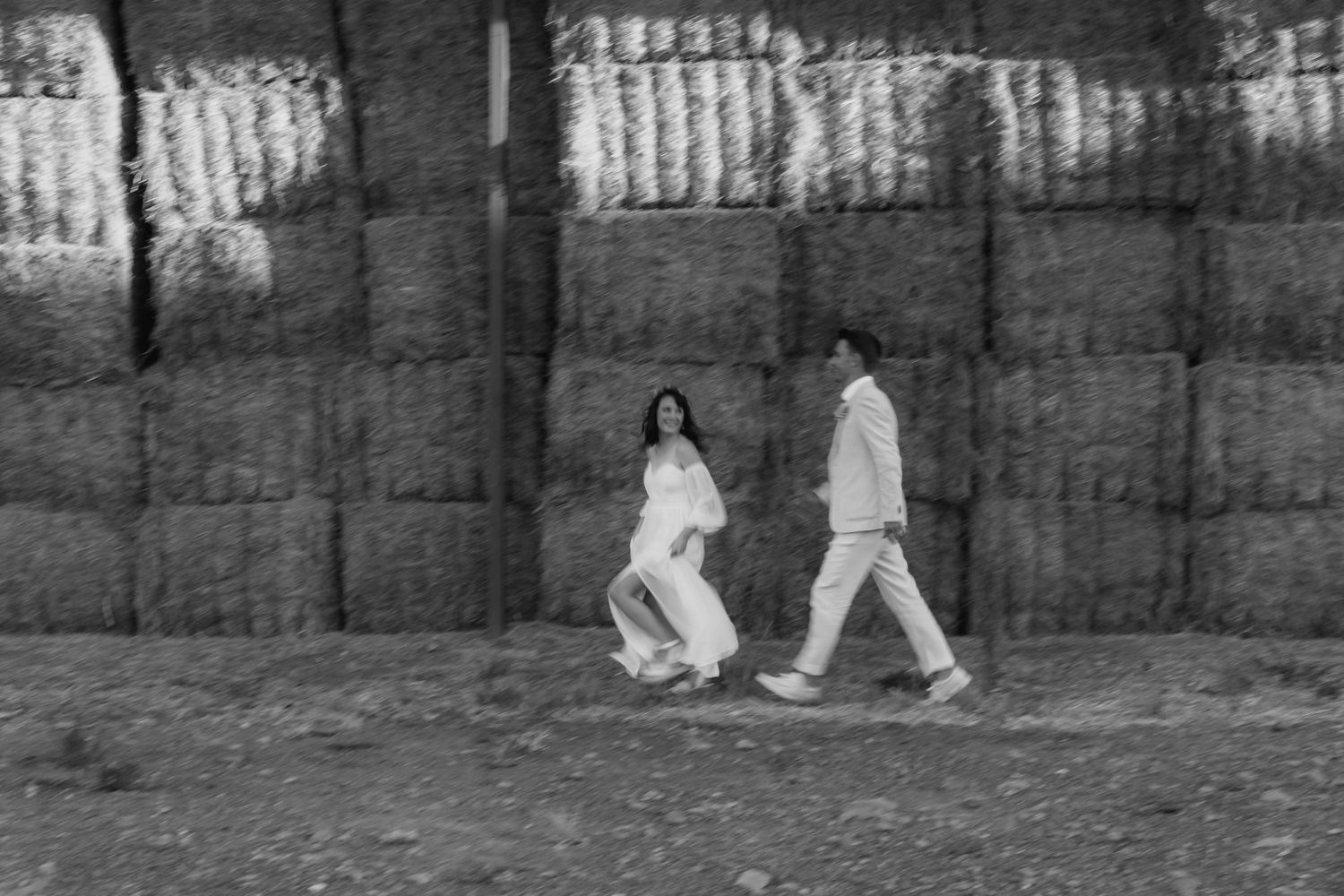 A black and white sequence of photographs showing someone walking and sitting down in a park setting.