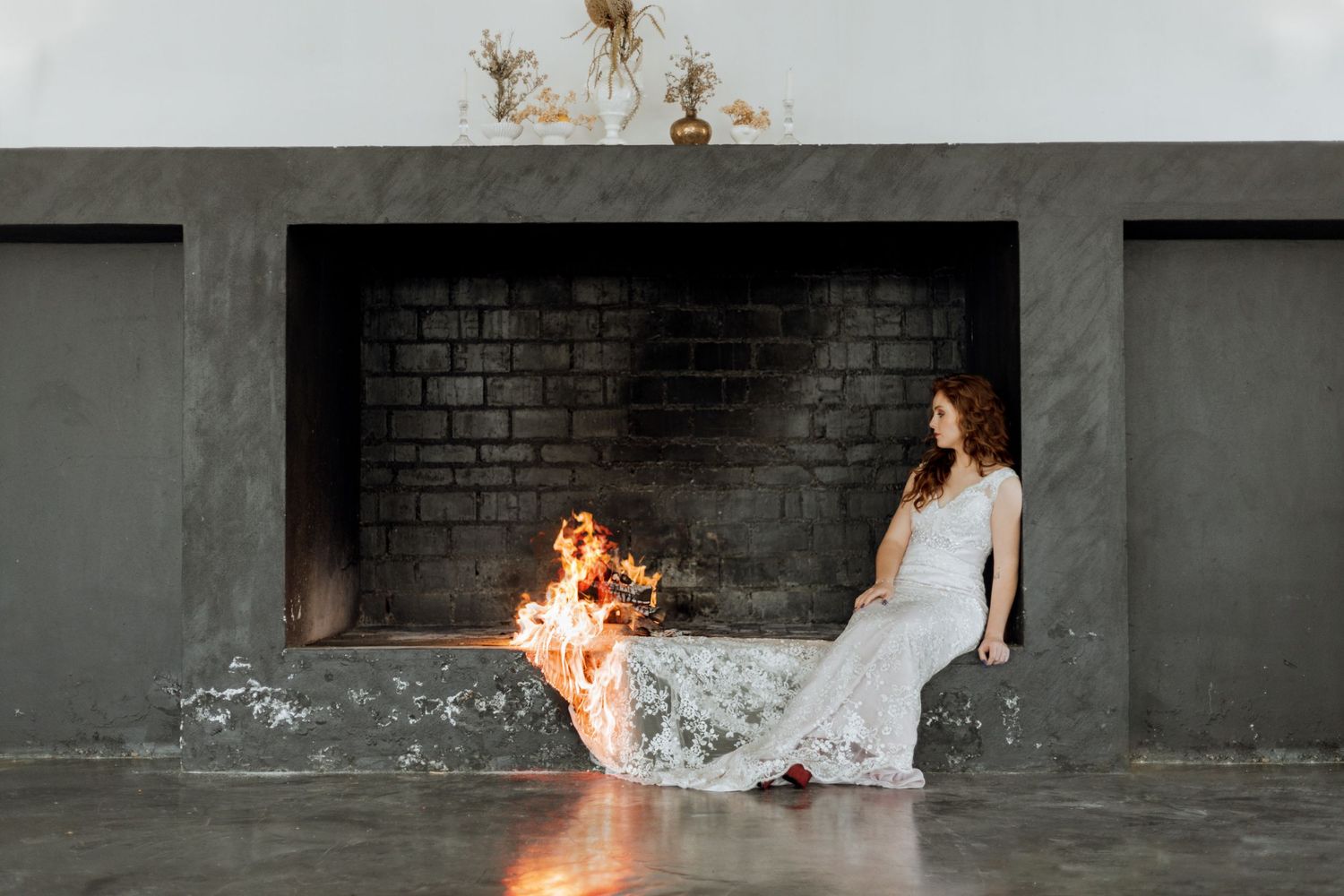 Four artistic frames showing a white wedding dress catching fire in a dramatic staged photo sequence.
