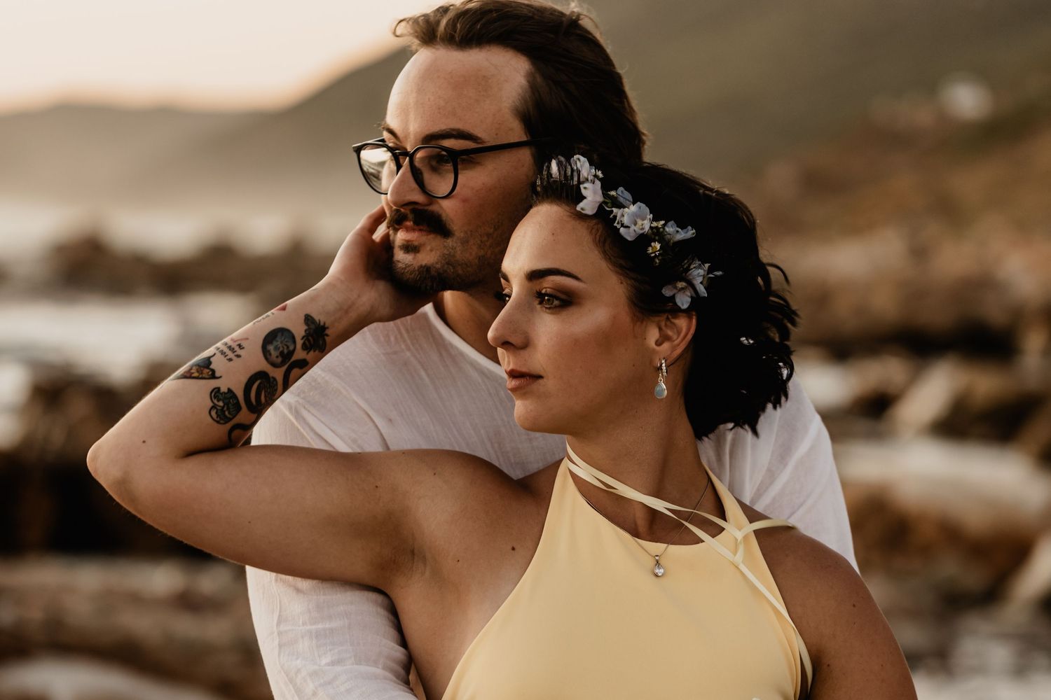 A sequence of artistic close-up shots showing minimal details of a couple during their beach wedding ceremony.