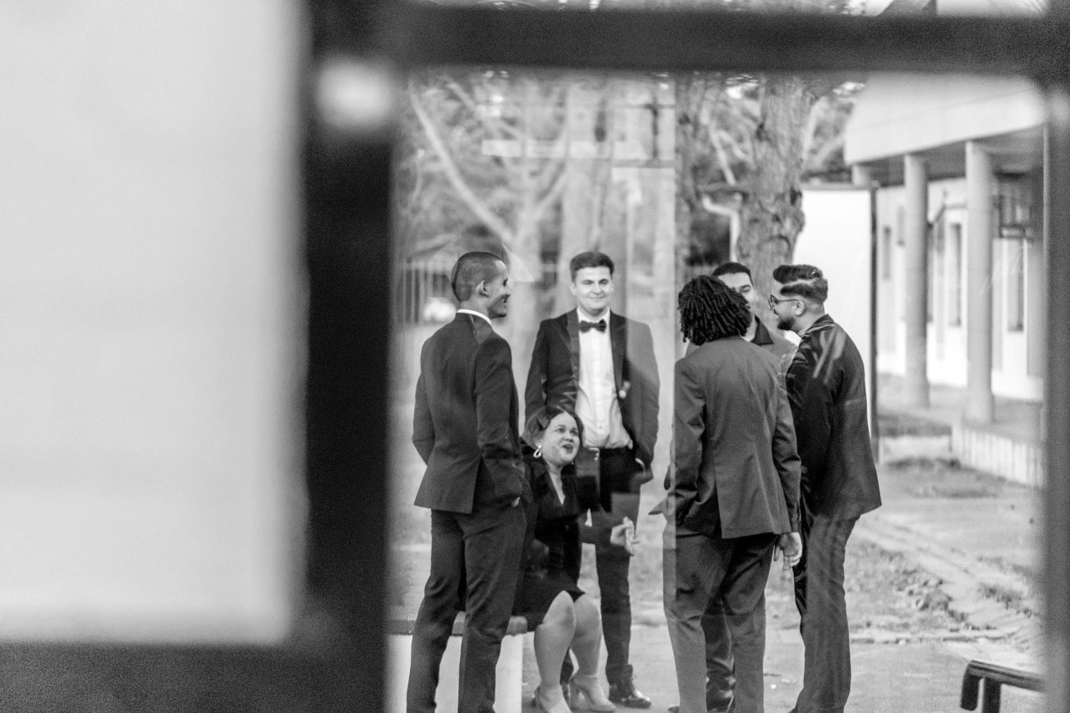 Historical black and white photo montage showing individuals on city sidewalks and street corners in the 1900s.