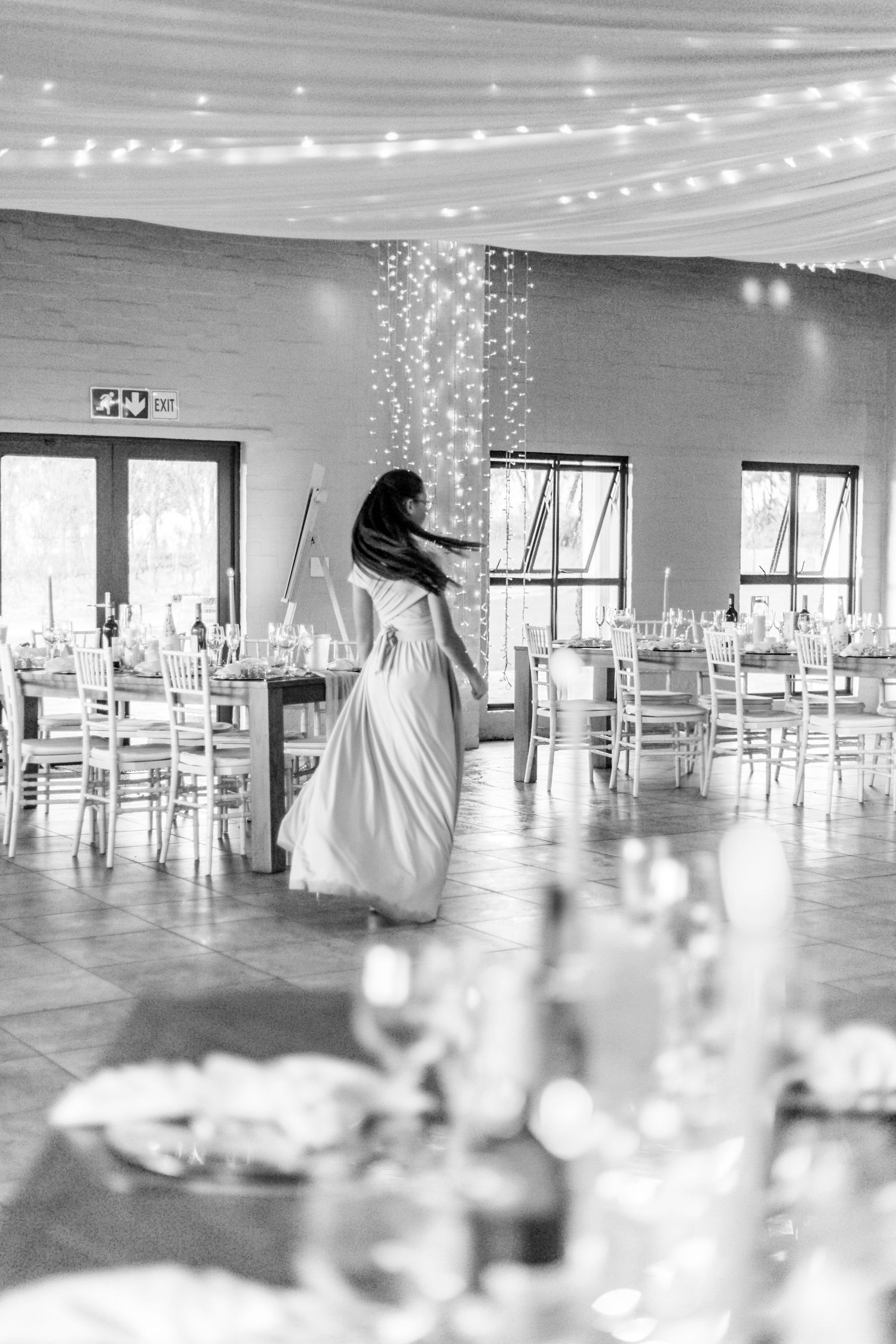 A panoramic view of an elegant white wedding venue with string lights and white decor showcases six connected angles.