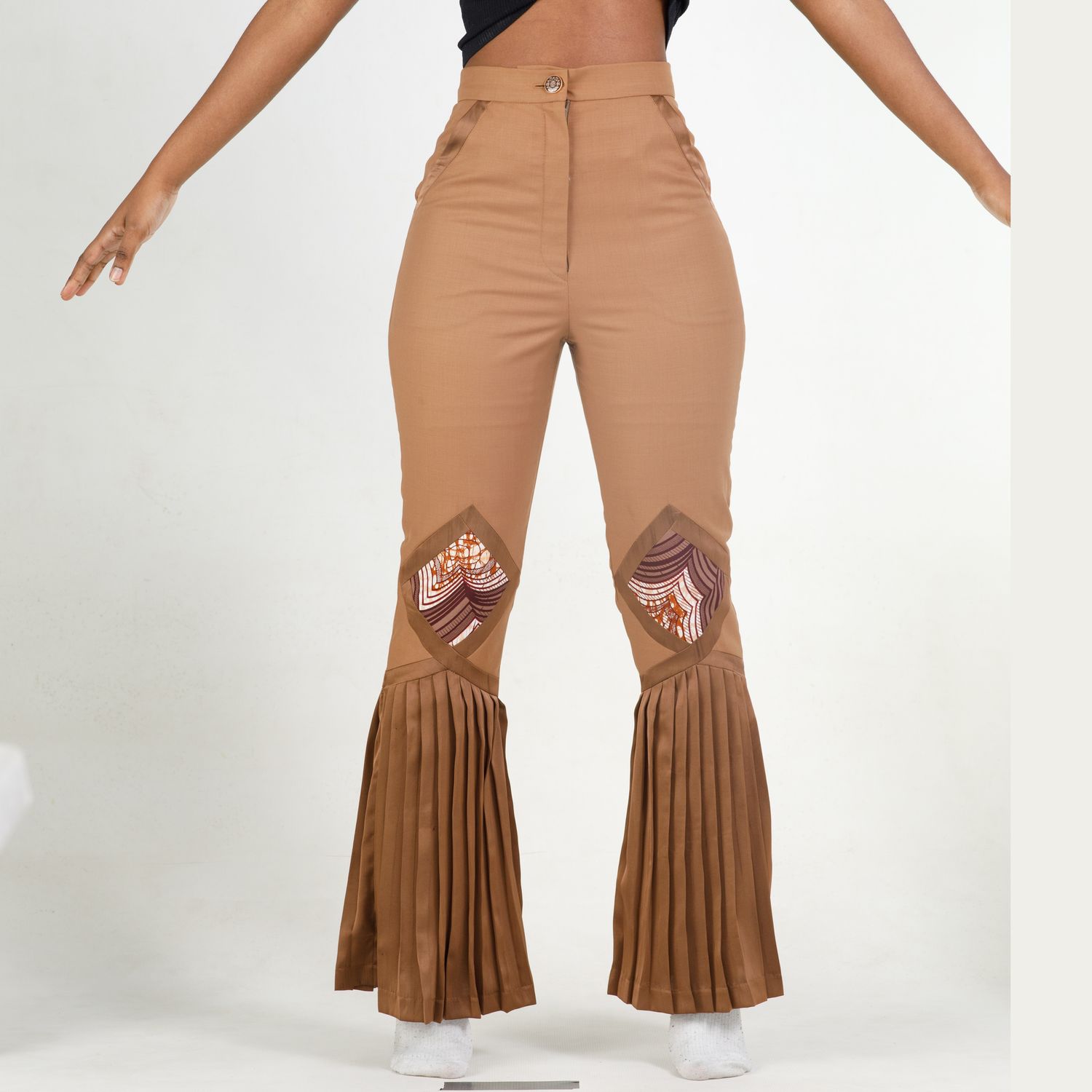 Modern fashion-forward brown bell bottom pants with pleated accents and eye-catching bear paw design details.