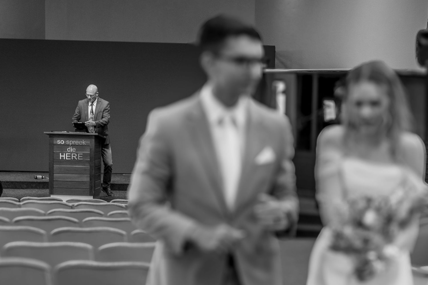 A black and white film strip showing multiple frames of swimming pool scenes and people in formal attire.