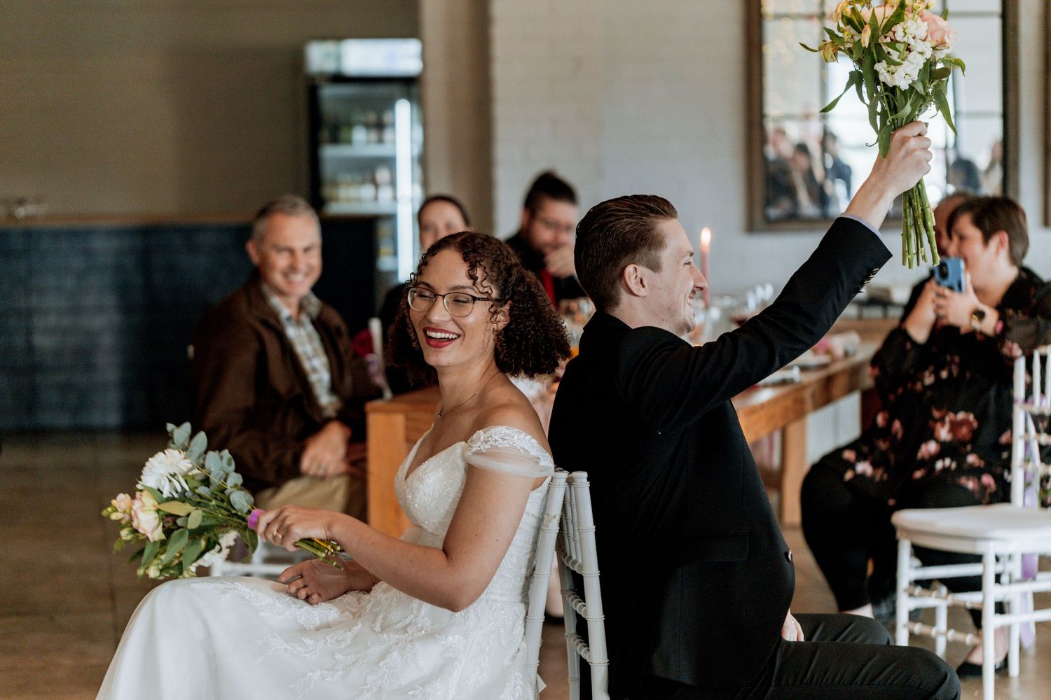 A montage of candid wedding celebration moments showing guests enjoying themselves at a reception.