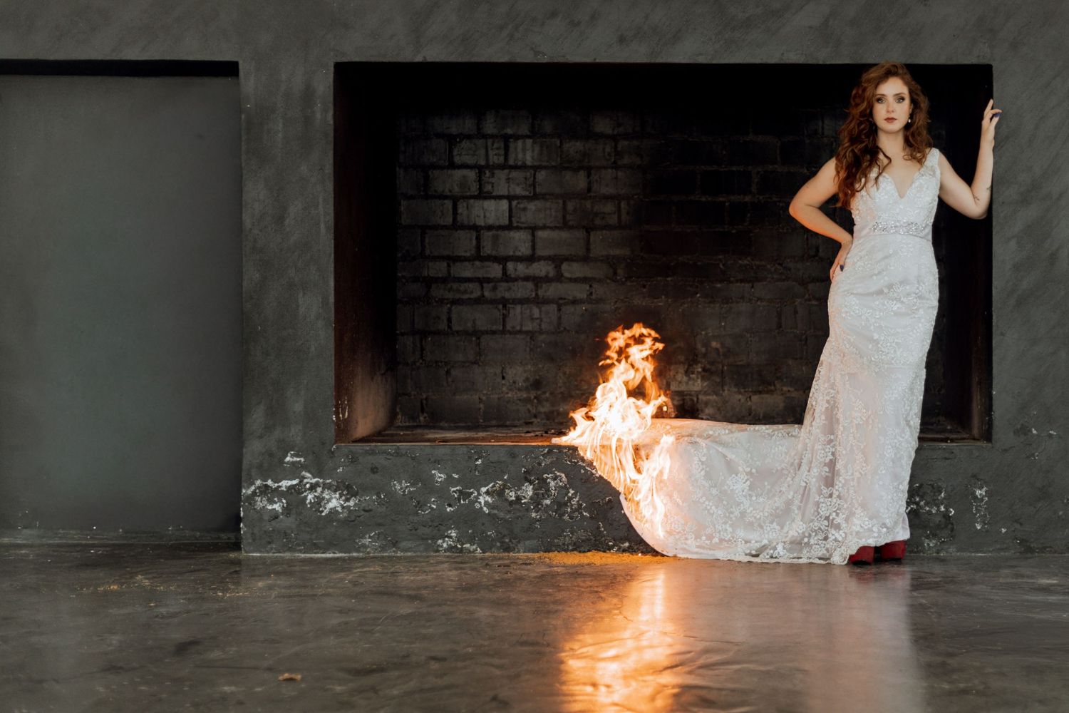Artistic photo sequence showing a white dress catching fire against a dark brick wall creating dramatic light effects.