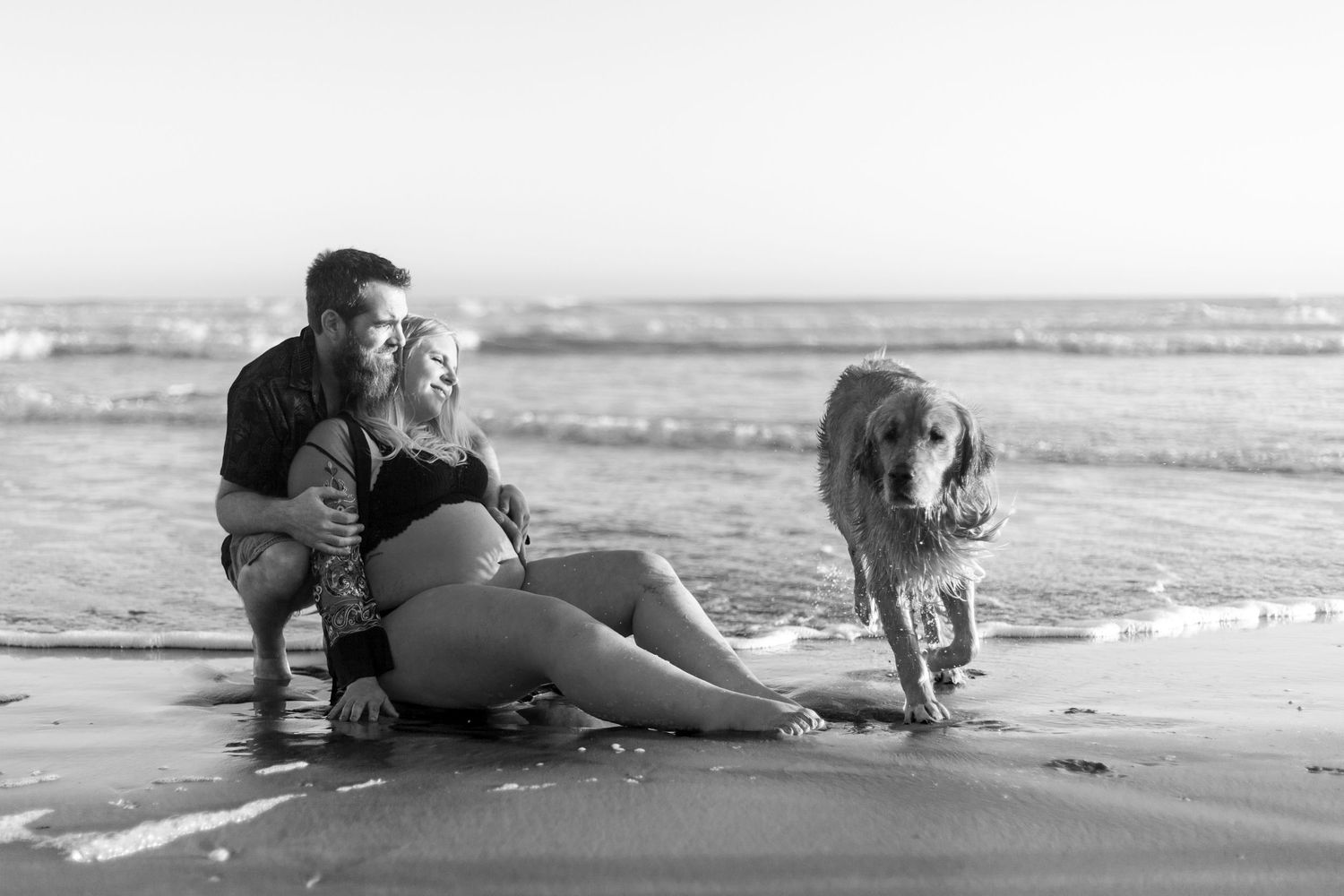 A sequence of black and white photos shows a couple embracing on a sandy beach.