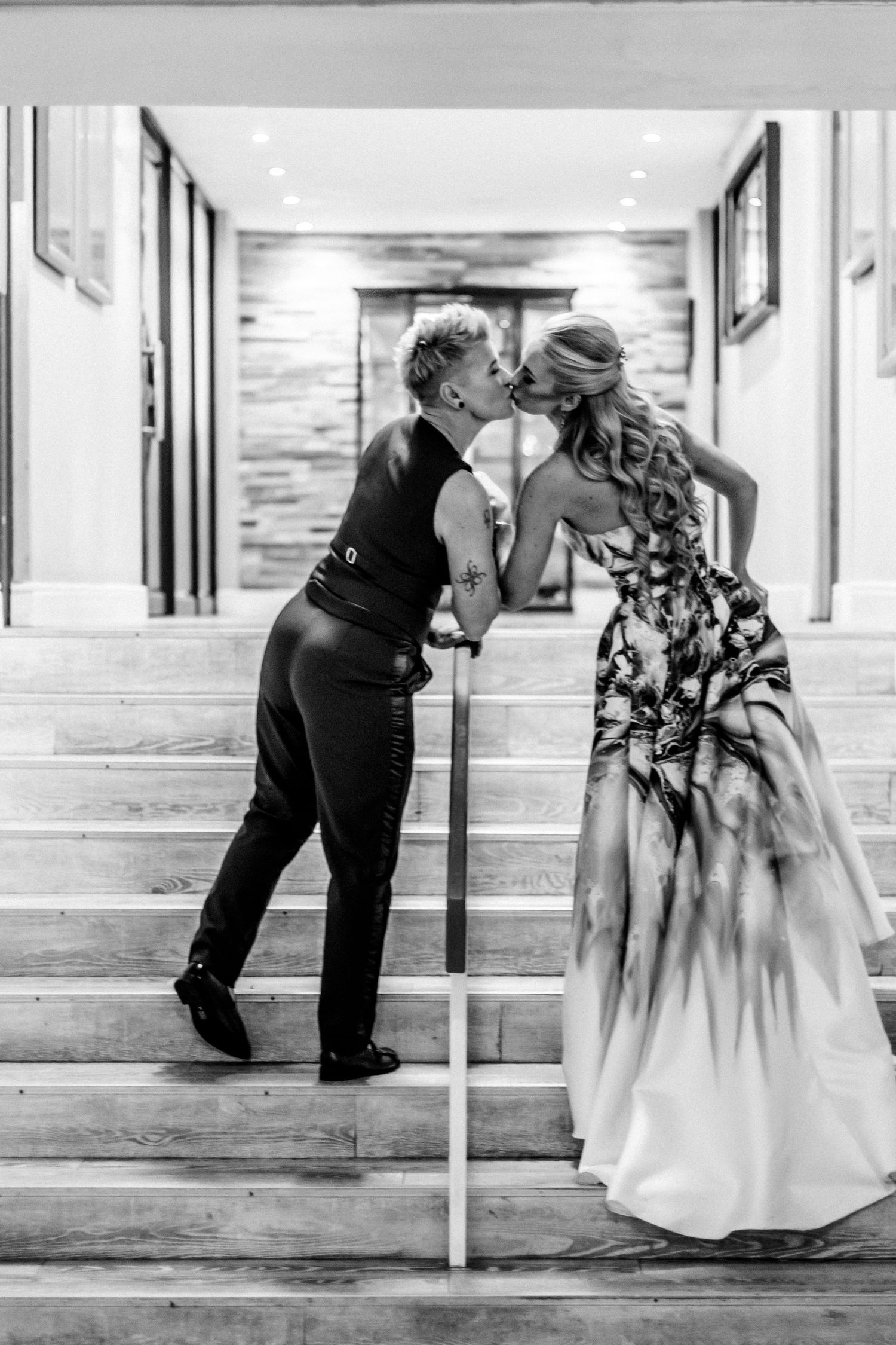 A black and white photo sequence showing a romantic kiss on steps in a wedding setting.