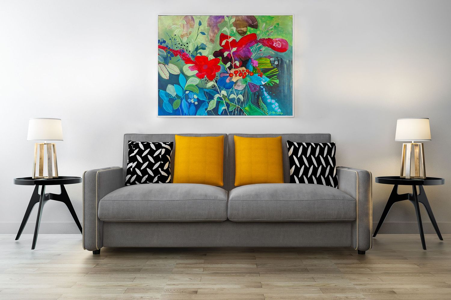 Modern living room interior showcases a gray sofa with yellow accent pillows and abstract art mounted over the couch.