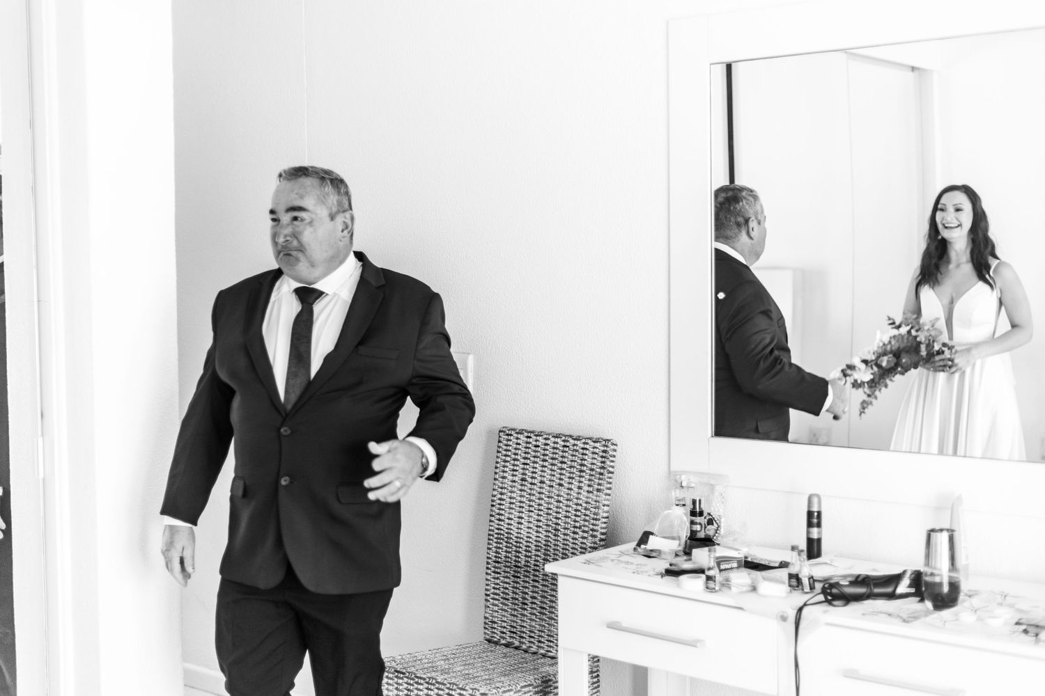 A black and white photo collage showing wedding moments with couples and guests in formal attire at an elegant venue.