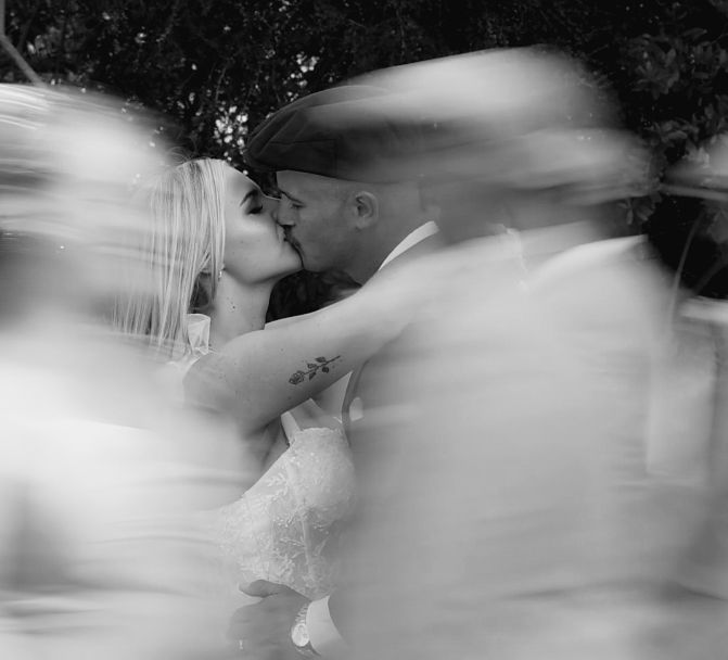 A series of black and white abstract motion blur photographs showing ethereal figures in flowing movement.